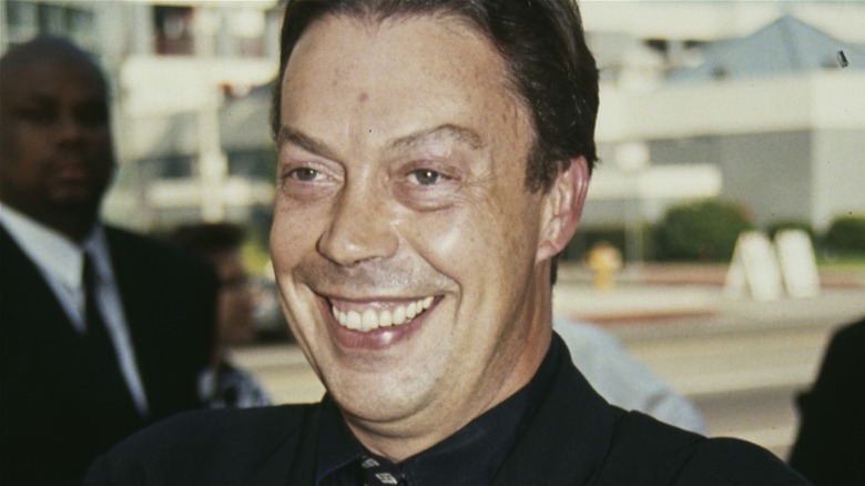 Tim Curry smiling at the Hollywood premiere of The Three Musketeers (1993)