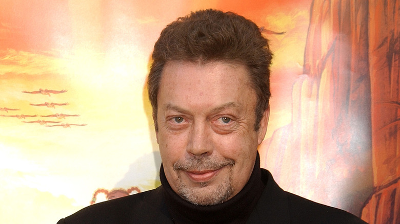 Tim Curry smiling at film premiere