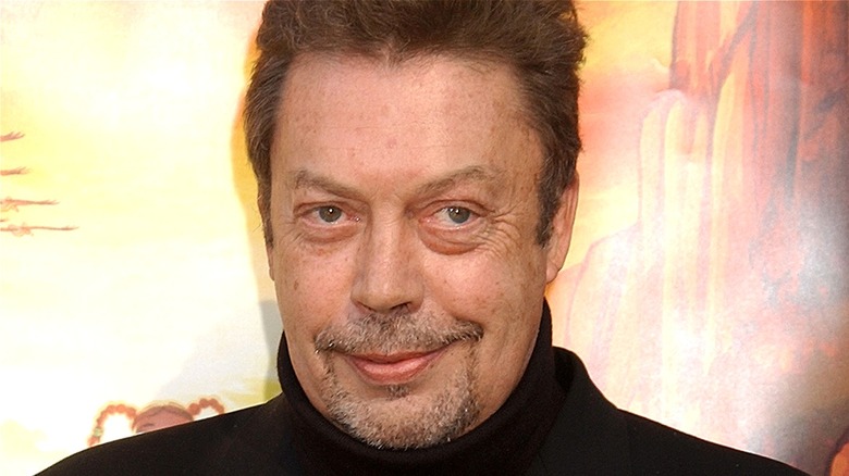 Tim Curry smiling at film premiere