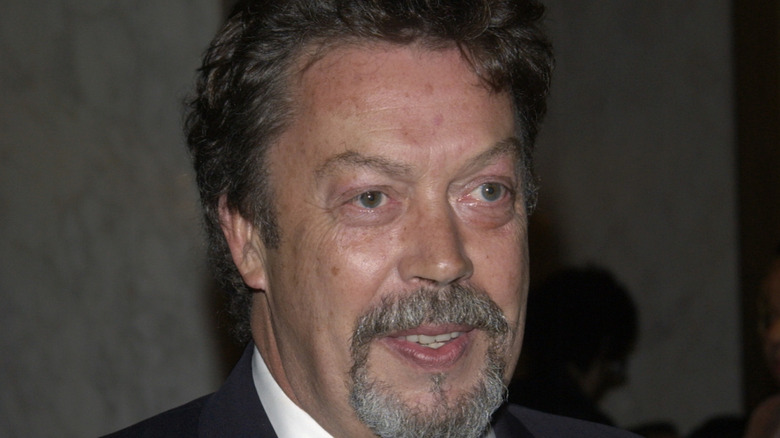 Tim Curry smiling at film premiere