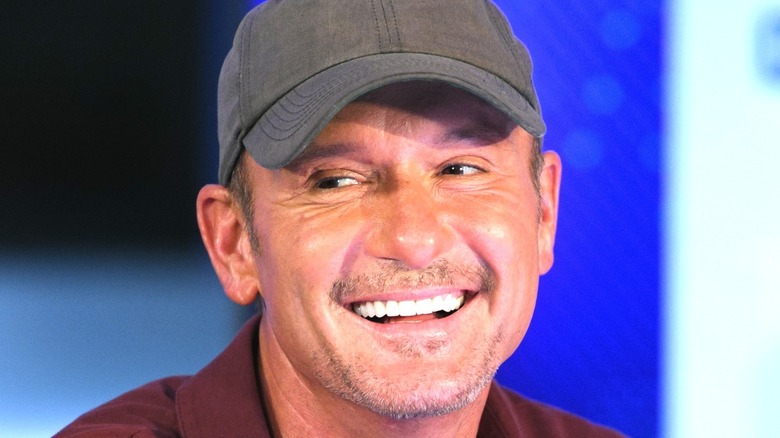 Tim McGraw baseball cap smile