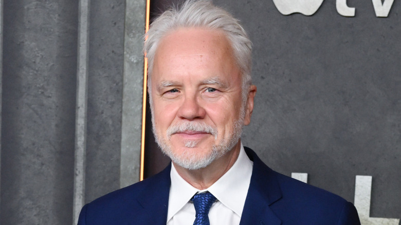 Tim Robbins squinting blue suit