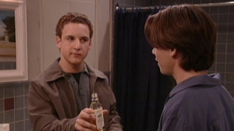 Cory handing Shawn alcohol
