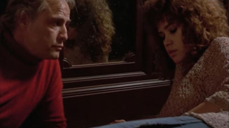 Marlon Brando Maria Schneider on floor