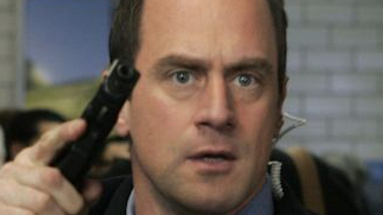 Stabler holds a gun