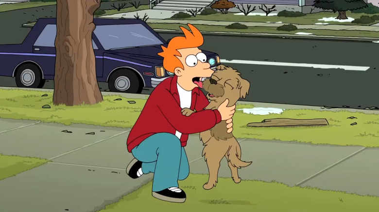 Fry licking Seymour the dog