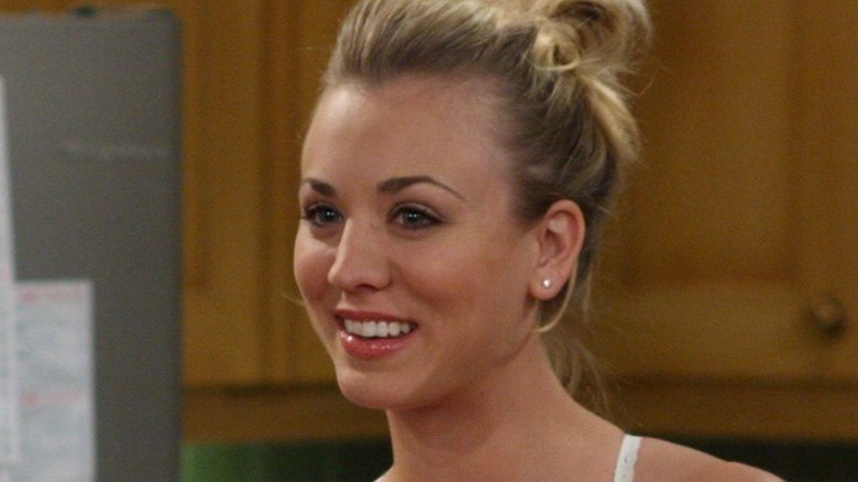 Penny smiling in Sheldon and Leonard's kitchen in 