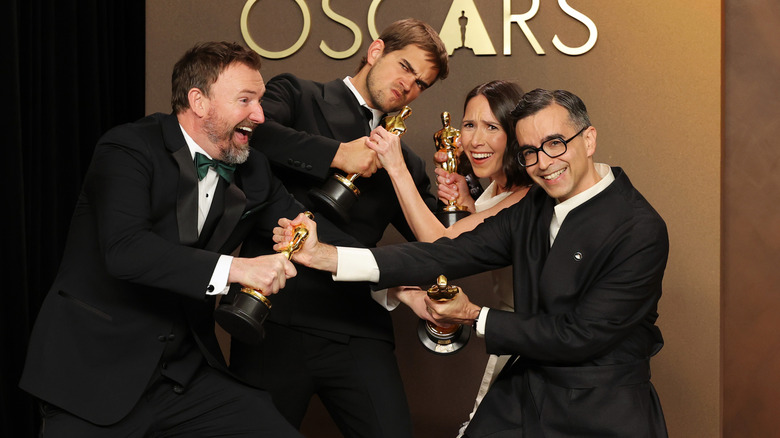 Jack Piatt, Sam A. Davis, Natalie Musteata, and Alexandre Singh play fight over their Oscars