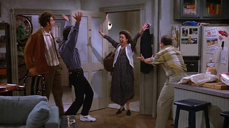 Kramer, Jerry, Elaine, and George celebrate