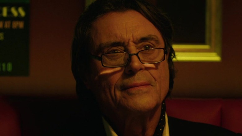 Ian McShane wearing glasses