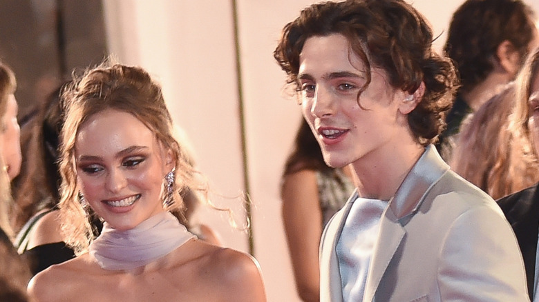 Lily-Rose Depp and Timothée Chalamet looking happy