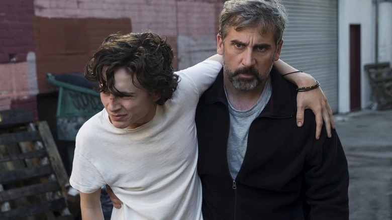Nic leaning on his dad David in an alleyway in Beautiful Boy