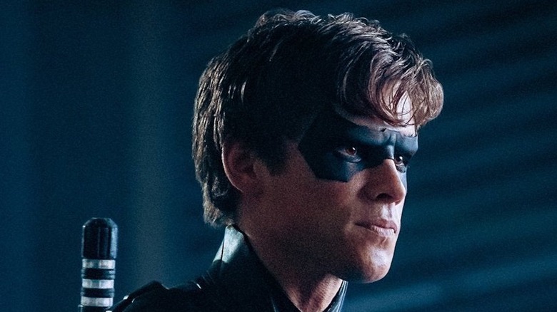 Nightwing pursing his lips