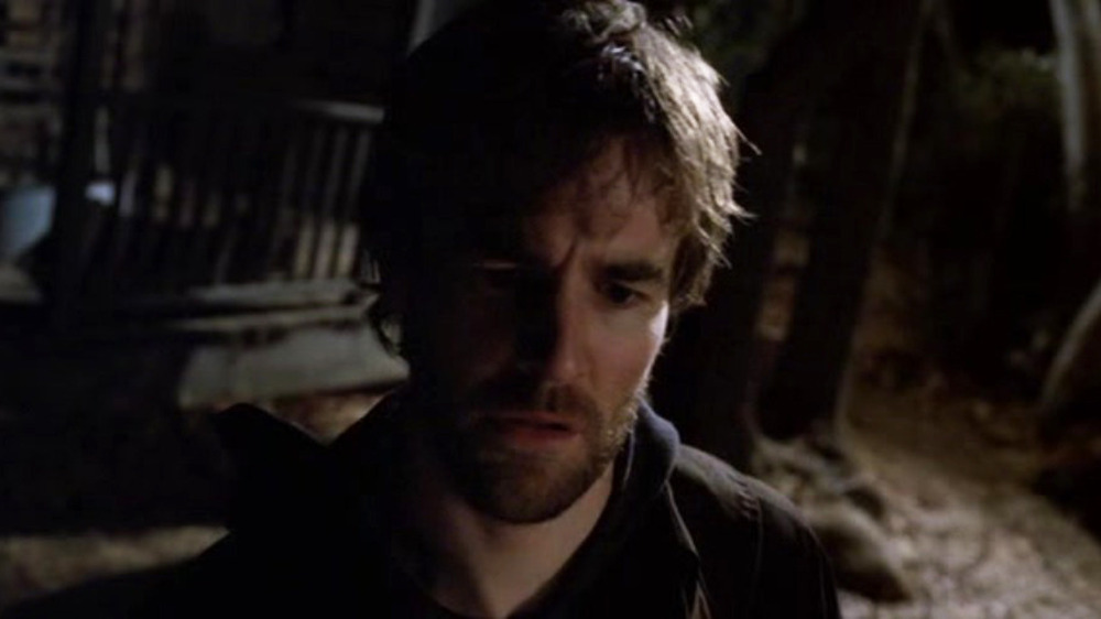 Tobias looking at something below him in Criminal Minds