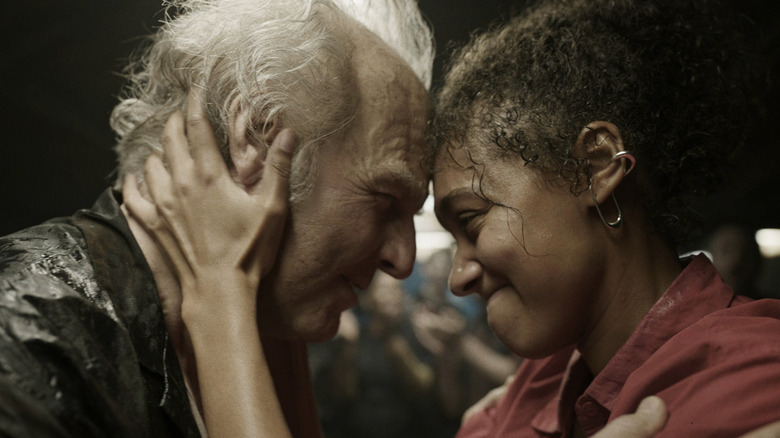 Curtis and Hannah touch foreheads in "Digger" (2026)
