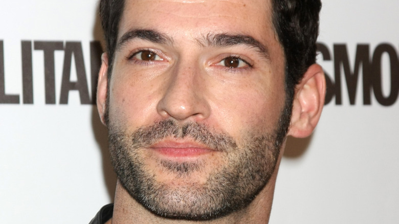 Tom Ellis looking somber