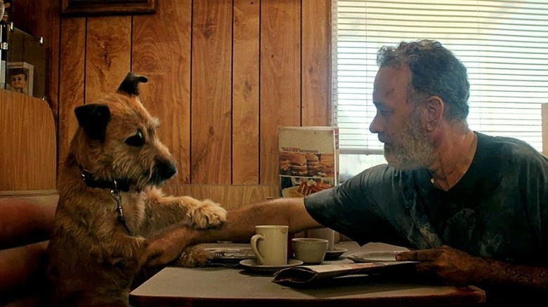 Goodyear with his paw on Finch's arm in Finch (2021)