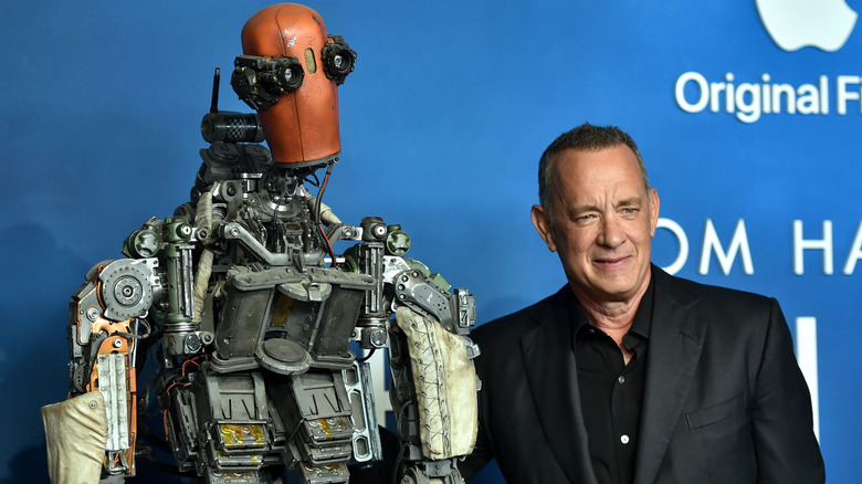 Tom Hanks posing with a robot
