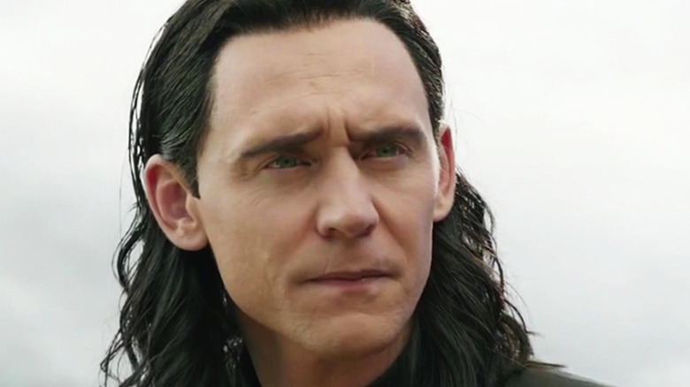 Loki looking concerned at Odin