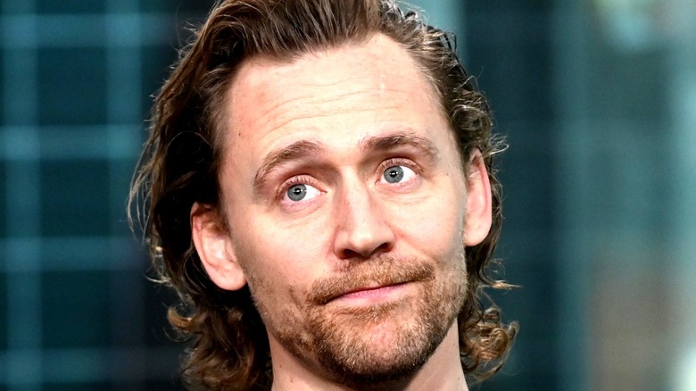 Tom Hiddleston looking up
