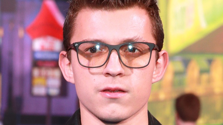 Tom Holland wearing glasses