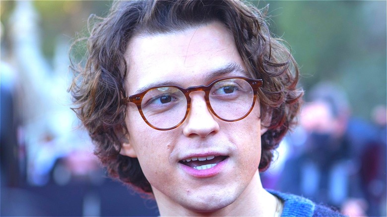 Tom Holland talking in glasses