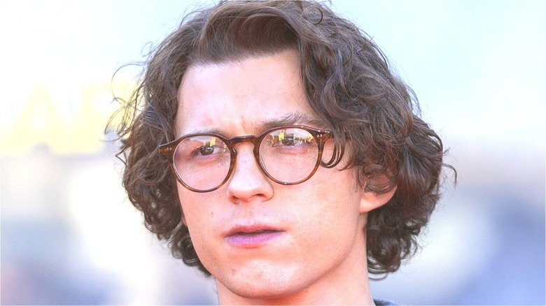 Tom Holland frowning in glasses