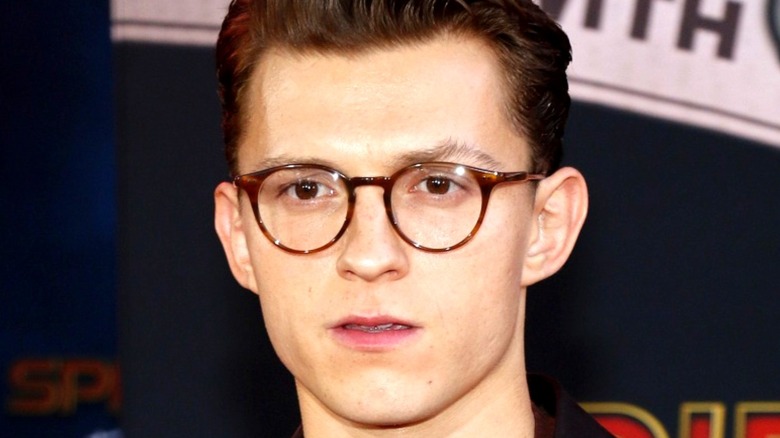 Tom Holland wearing glasses