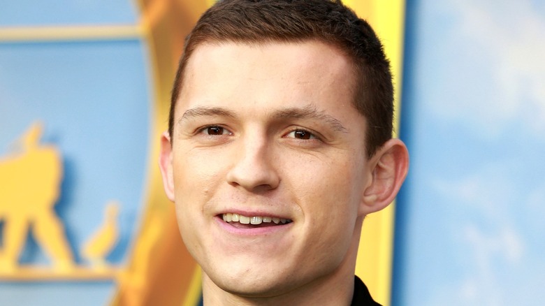 Tom Holland smiling at event