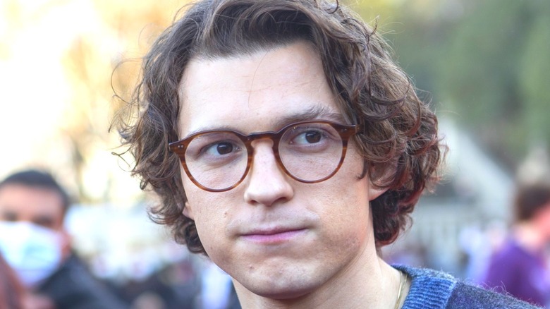 Tom Holland in a pair of tortoiseshell glasses