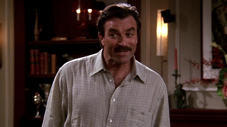 Dr. Richard Burke grinning sarcastically