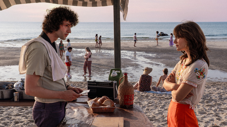 Tony talking to Nancy on the beach in Tony