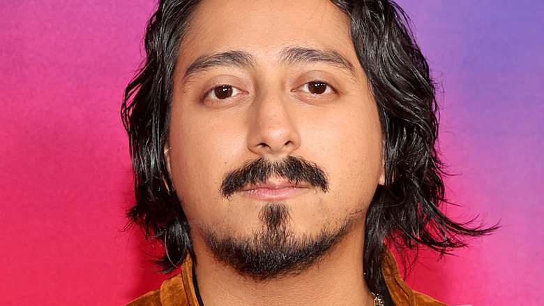 Tony Revolori posing at a premiere