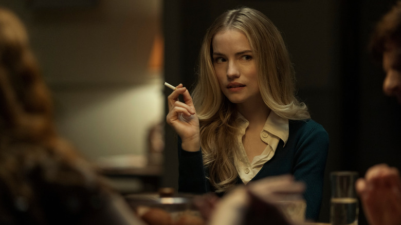 Young Madeline holding a cigarette on "The Fall of the House of Usher" (2023)