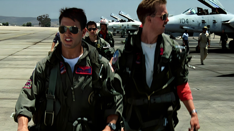 Maverick and Goose wearing flight gear
