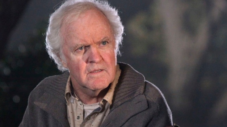 Clifford Stuckey faces someone in the night on Castle.