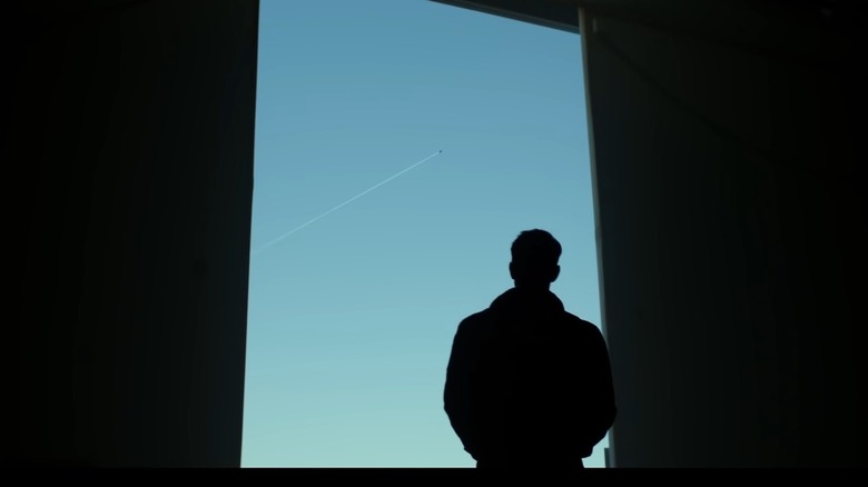 Tom Cruise looking at sky