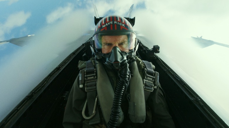 Maverick sits in a fighter jet