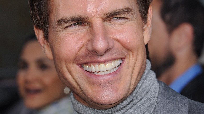 Tom Cruise smiling at an event