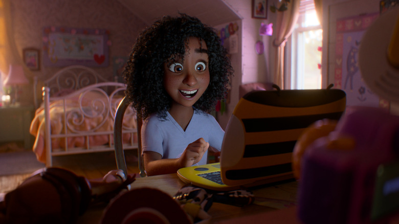 Blaze smiling in front of her laptop in "Toy Story 5" (2026)