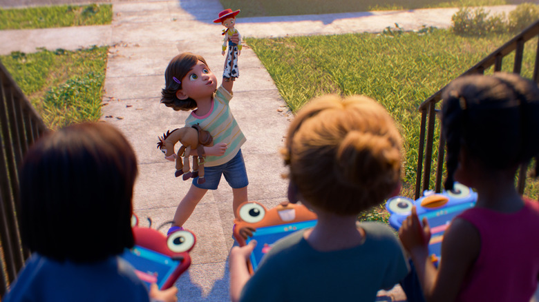 Bonnie playing with Jessie and Bullseye while three other kids watch, holding Lilypads, in "Toy Story 5" (2026)