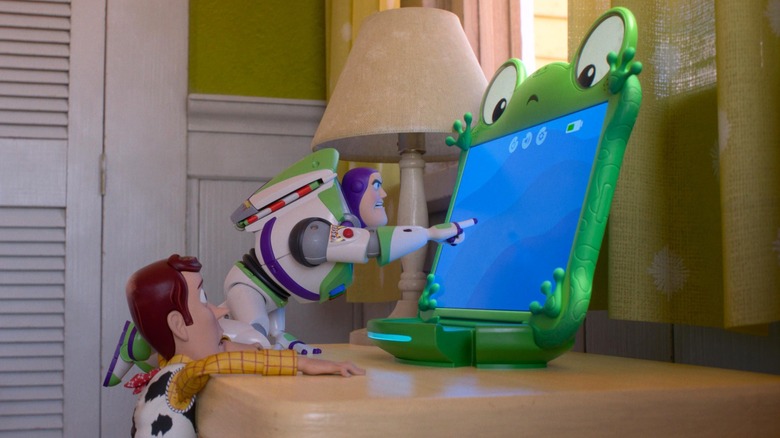 Woody and Buzz look angrily at Lilypad in 