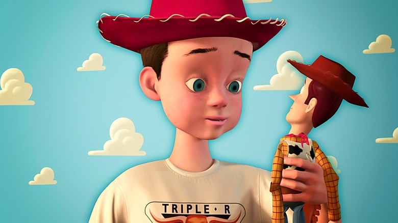 Andy holding Woody