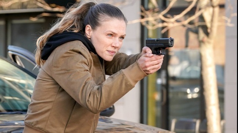 Tracy Spiridakos aiming gun