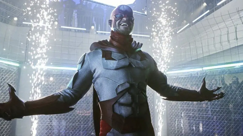 Hank Hall in a cage with sparks and crowds behind him on "Titans" (2018-2021)