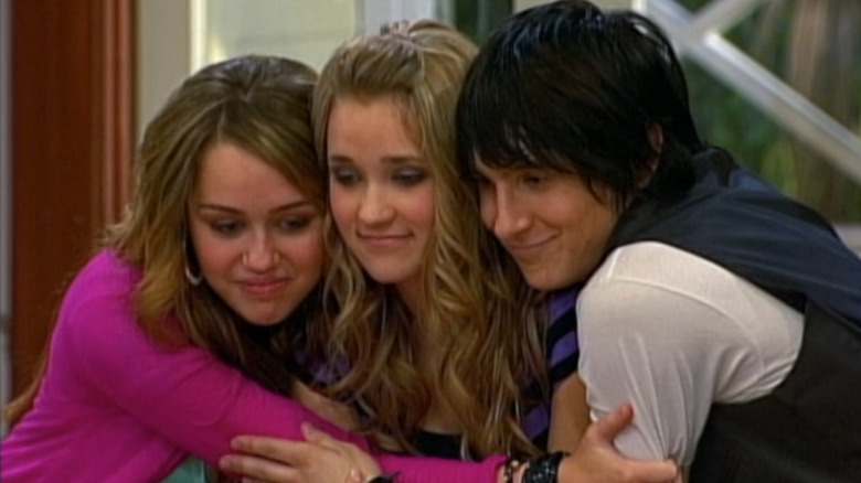 Miley, Lilly, and Oliver hugging on 