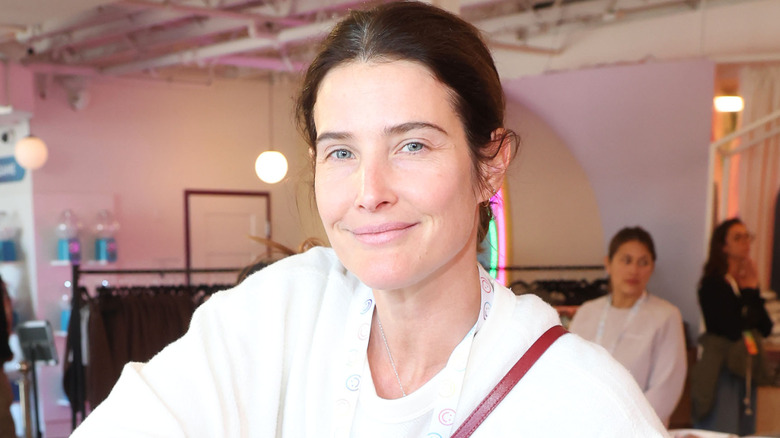 Cobie Smulders smiling while volunteering with LA Fire relief in Los Angeles in 2025.