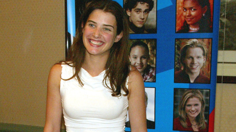 A young Cobie Smulders smiling