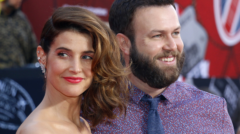 Cobie Smulders and Taran Killam smiling on the red carpet