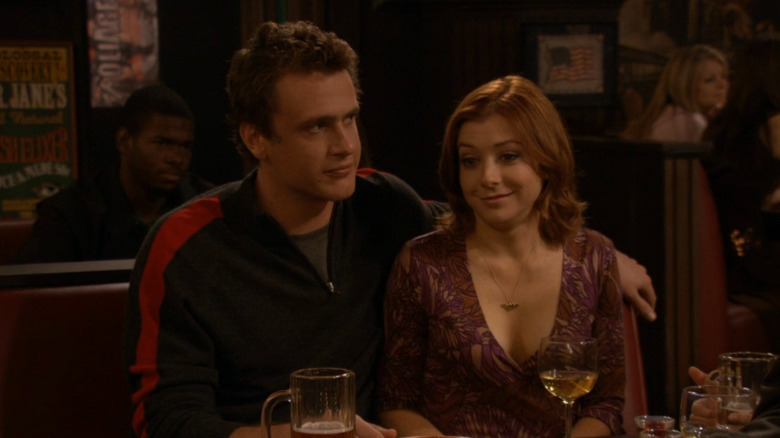 Marshall with his arm around Lily on "How I Met Your Mother" (2005-2019)